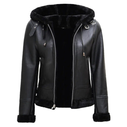 Woman wearing the Women’s Black Leather Hooded Shearling Jacket featuring sleek black leather, soft shearling lining, and a cozy hood for a stylish and warm winter look.
