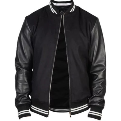 Stylish man wearing the Harrison Black Varsity Jacket, featuring a sleek black body with contrasting sleeves, ribbed cuffs, and a classic sporty design perfect for modern streetwear.